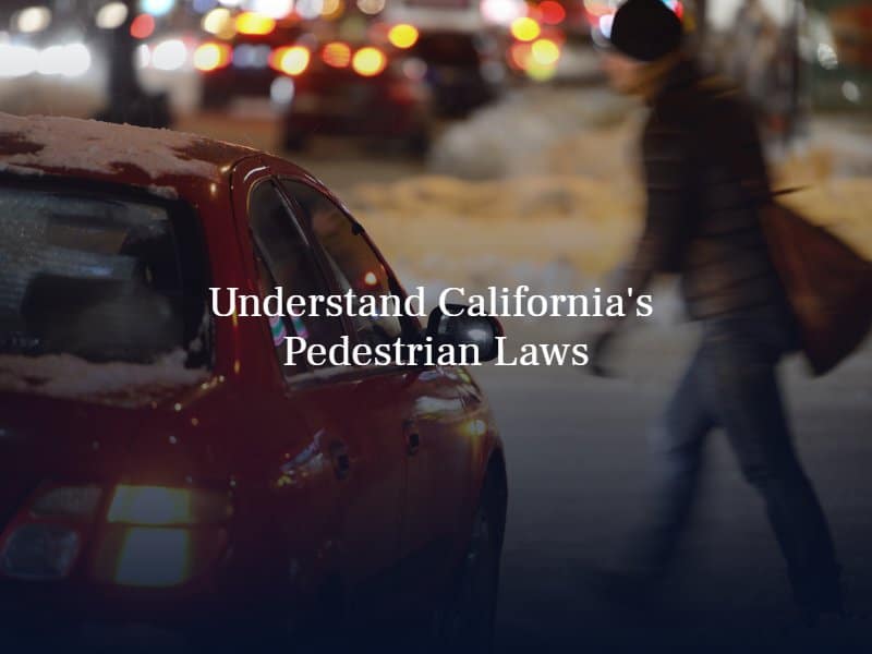 a person crossing the street in front of a red sedan. Text: "Understand California's Pedestrian Laws"